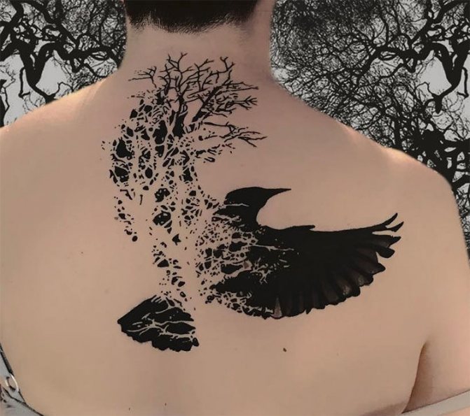 Abstract tattoo of a raven on his back