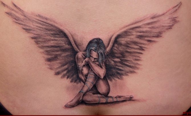 Angel in the form of a girl - tattoo on his back