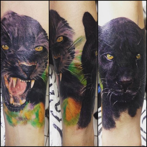 Large panther tattoo on arm