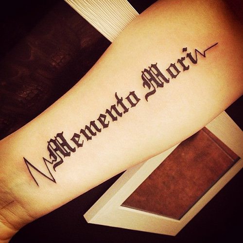 Carpe diem Memento Mori tattoo in Latin. Photo, meaning