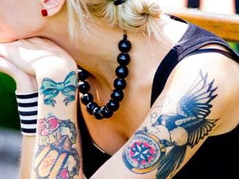 colored tattoo on a woman's bicep