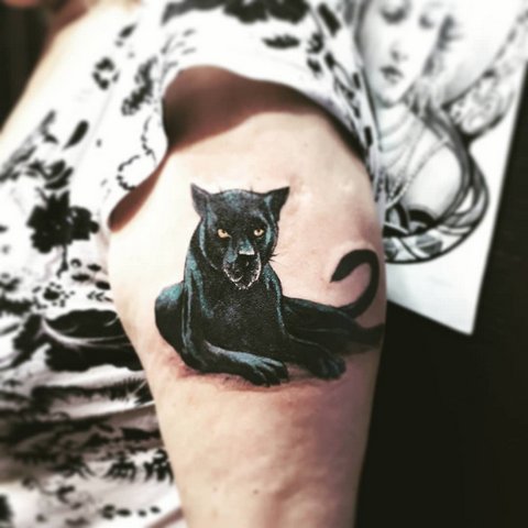 Colored tattoo of a black panther