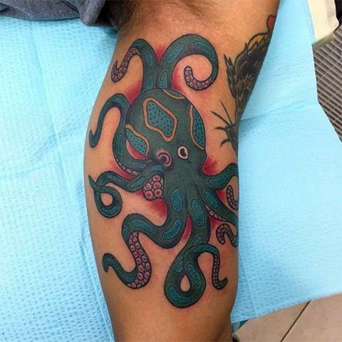 Colored octopus on hand - photo tattoo