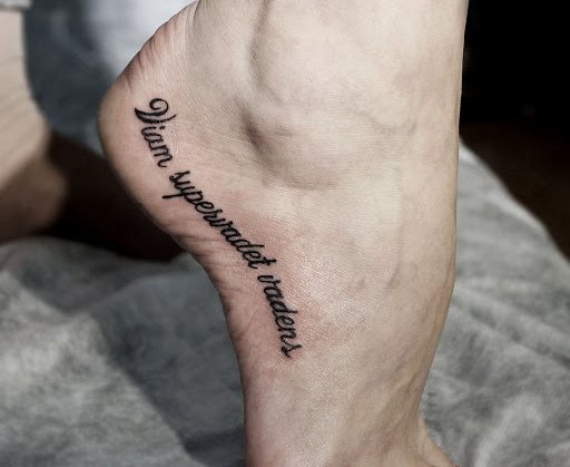 The way the going gets rich tattoo in Latin. Photo, meaning