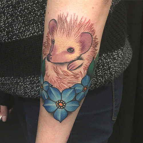 Hedgehog tattoo on the forearm