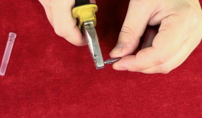 Needle is extracted with pliers
