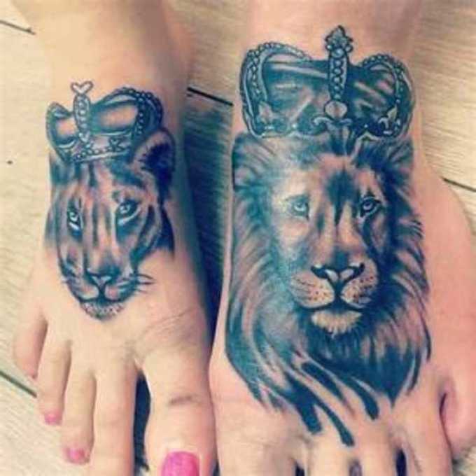 Interesting tattoo of a lion and a lioness