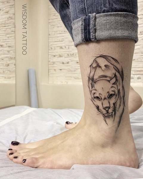Panther tattoo on leg