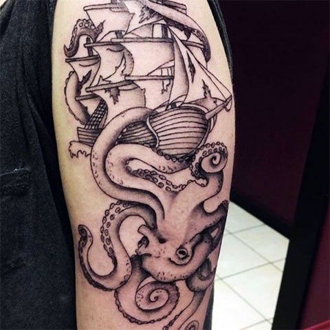 Ship and octopus - a male tattoo on the arm