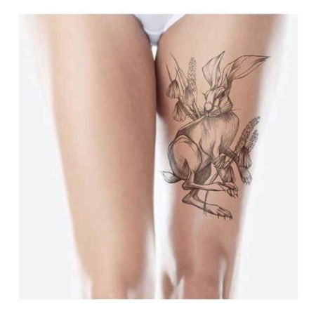 Rabbit tattoo on the thigh