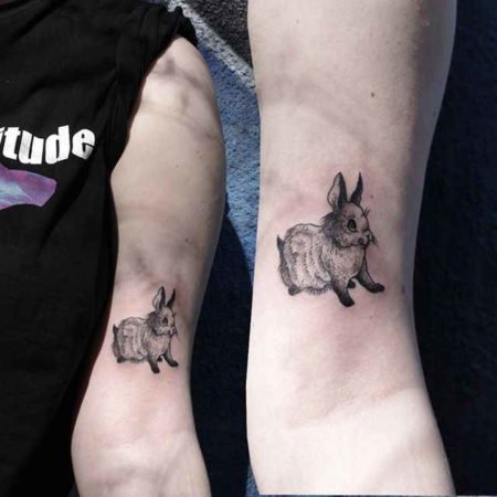 Rabbit tattoo on the biceps