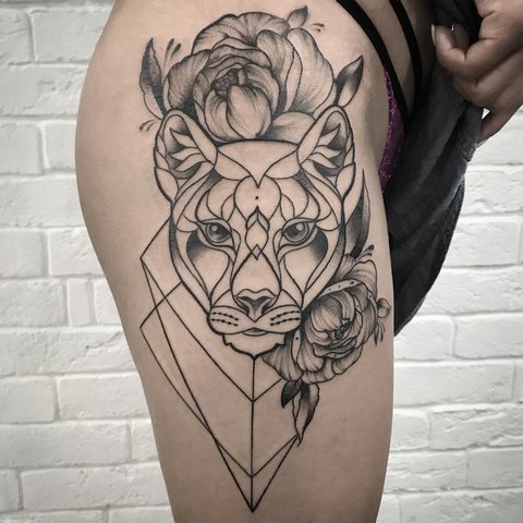 Cool panther tattoo with flowers on the hip