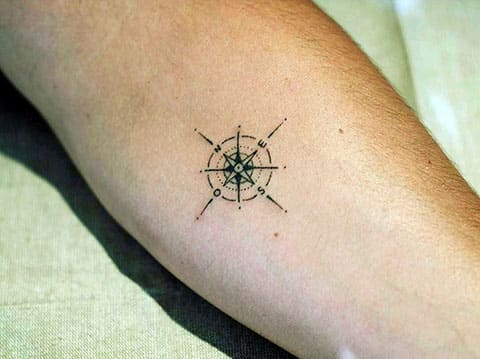 Small compass tattoo