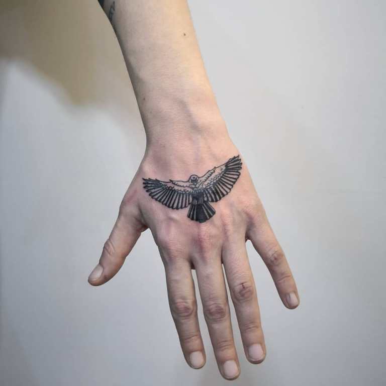 Small tattoo on a guy's wrist