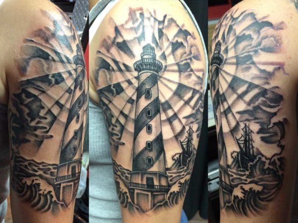 Lighthouse tattoo on the shoulder