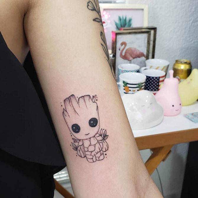 Mini Tattoo Groot on his arm