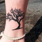 miniature tree on a girl's leg
