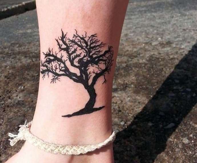 Miniature tree on a girl's leg