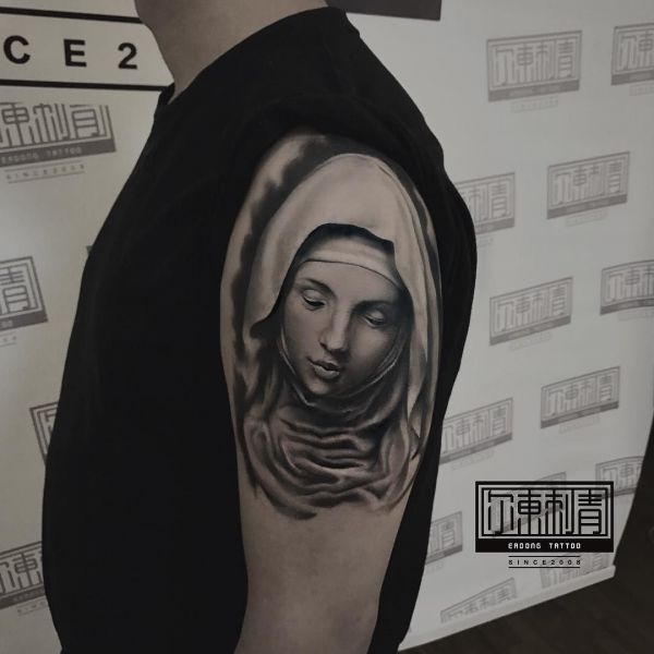 Nun on the shoulder as a tattoo