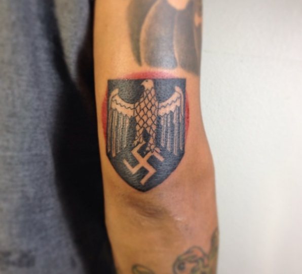 Nazi Tattoo on the Elbow: Swastika