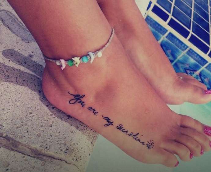 the inscription on the girl's foot