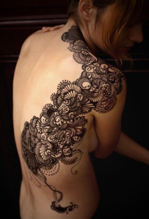 Even though it's not lace, this subtle and decorative tattoo design is inspired by a lace pattern.
