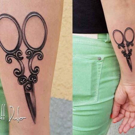 Scissors tattoo on forearm
