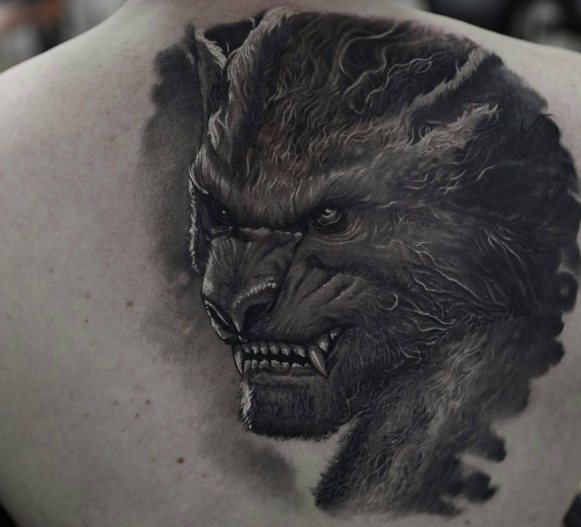 Werewolf on a guy's back, tattoo