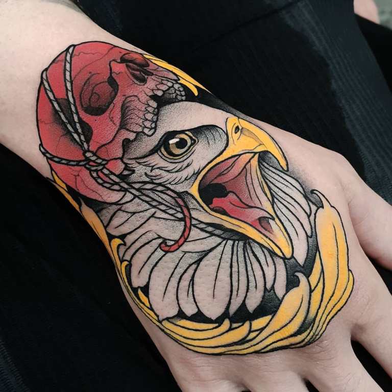 Eagle on the wrist with a skull