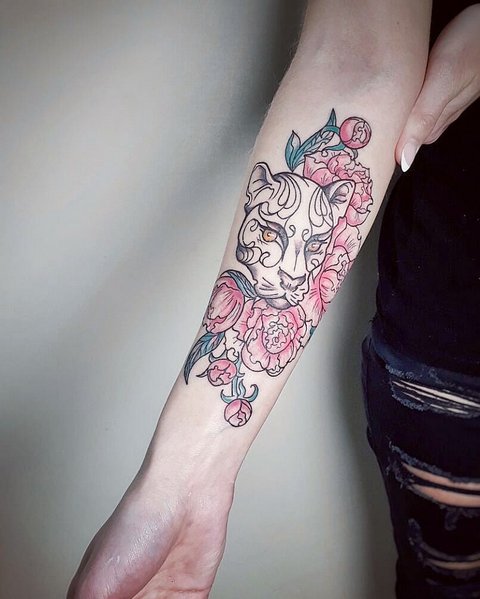 Panther with flowers on his arm