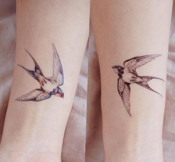 Paired tattoo as swallows - feminine and beautiful