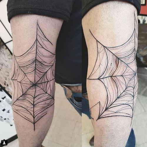 Cobweb tattoo on the elbow