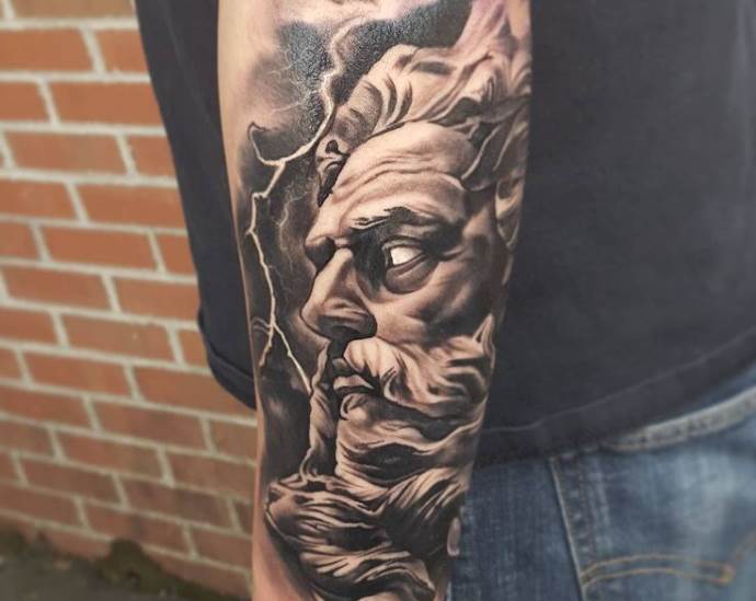 Face profile on a man's elbow