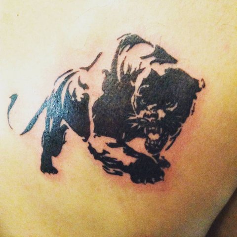 Simple panther tattoo with open mouth