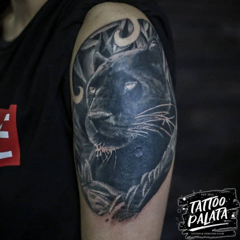 Realistic panther tattoo on shoulder