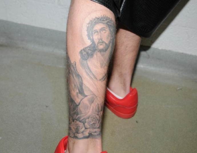 religious leg tattoo