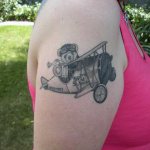 Airplane tattoo on the shoulder