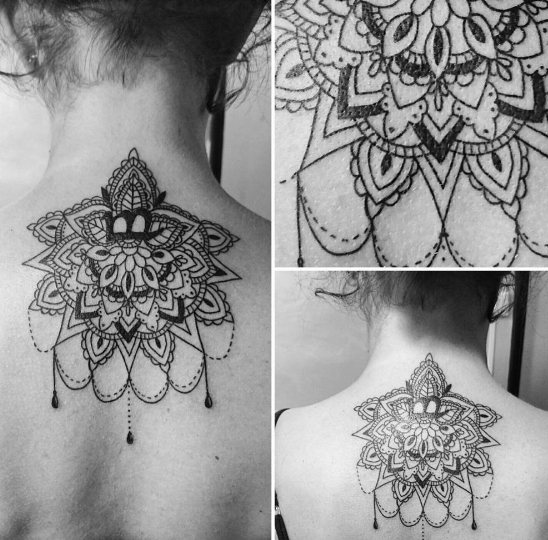 Baroque style tattoo with lace on the back of a girl