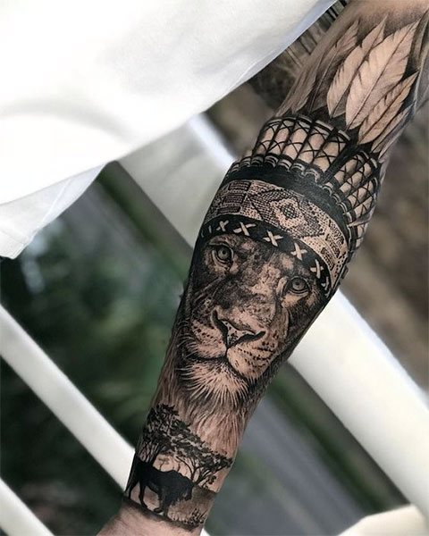 Plot tattoo of a lion on his arm for men