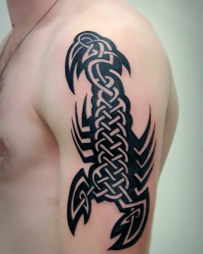 Tattoo abstract scorpion on shoulder