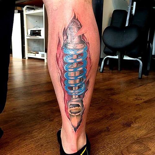 Tattoo shock absorber on the leg. Photo, meaning, sketches