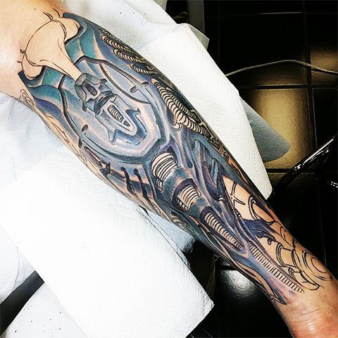 Tattoo of biomechanics on legs