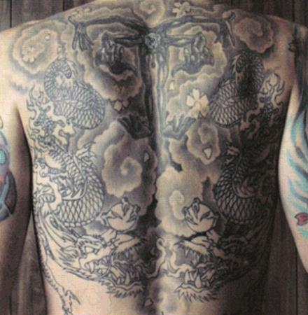 Chester tattoos on his back
