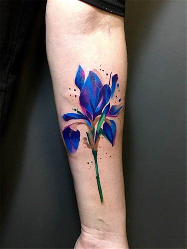Tattoo Flowers. Sketches of black and white, colored on the arm, collarbone, leg, thigh