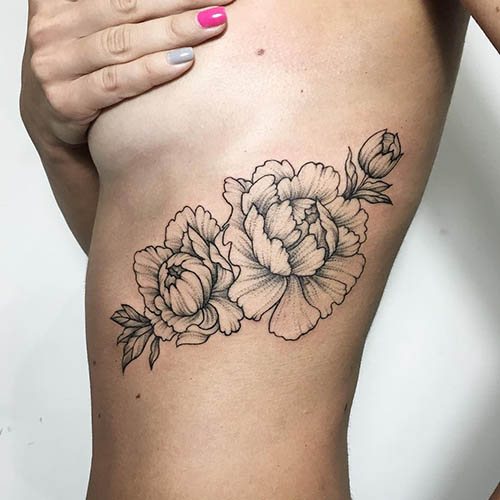 Tattoo Flowers. Sketches of black and white, colored on the arm, collarbone, leg, thigh