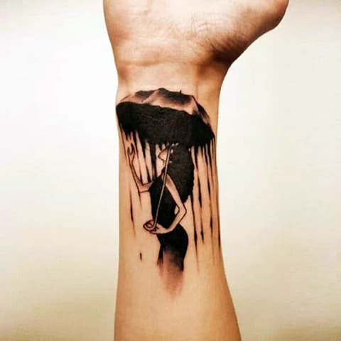 Tattoo girl with an umbrella on the wrist