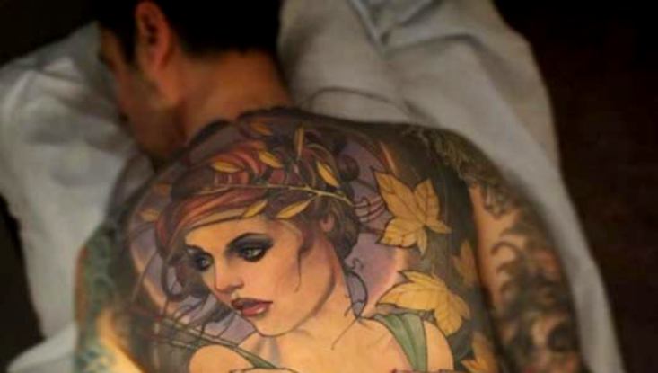Tattoo of a girl on the forearm for men