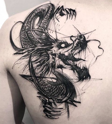 Dragon tattoo on the shoulder blade of a man