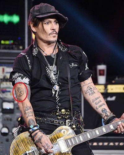 Tattoo of Johnny Depp. Pictures on the arm, back, hand