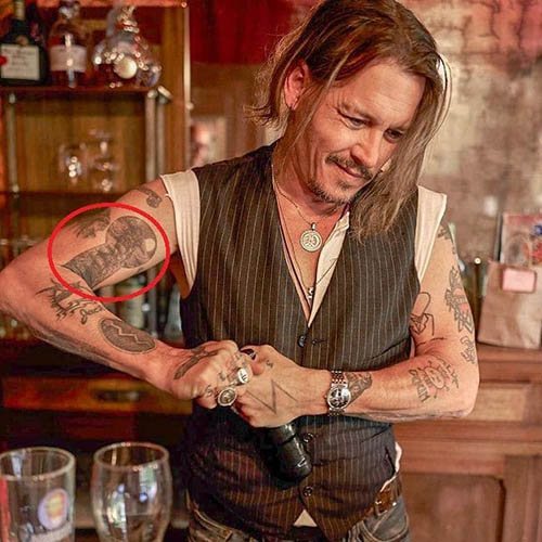 Johnny Depp tattoo. Pictures on the arm, back, hand